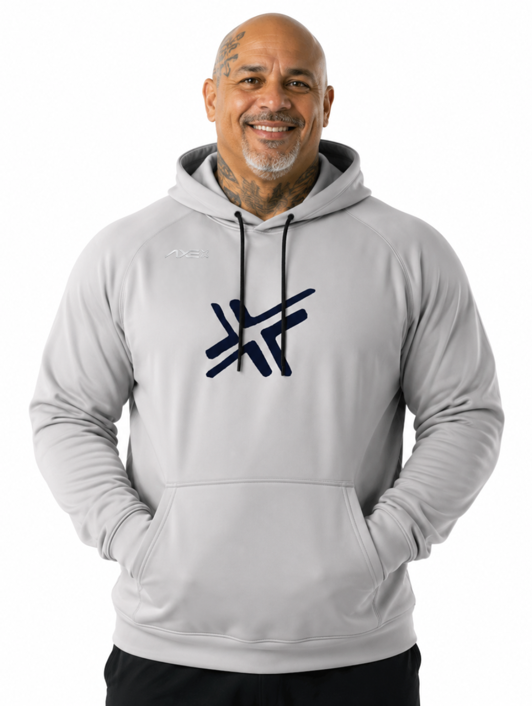 A smiling man wearing a light gray pullover hoodie with a dark navy stylized logo on the chest, photographed against a plain white background.