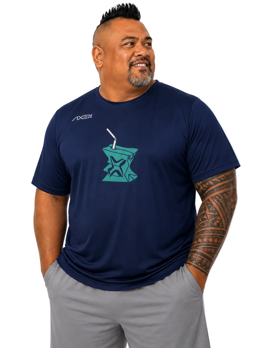 A man wearing a navy blue short-sleeve t-shirt with a teal graphic on the chest and gray shorts, standing against a plain white background.