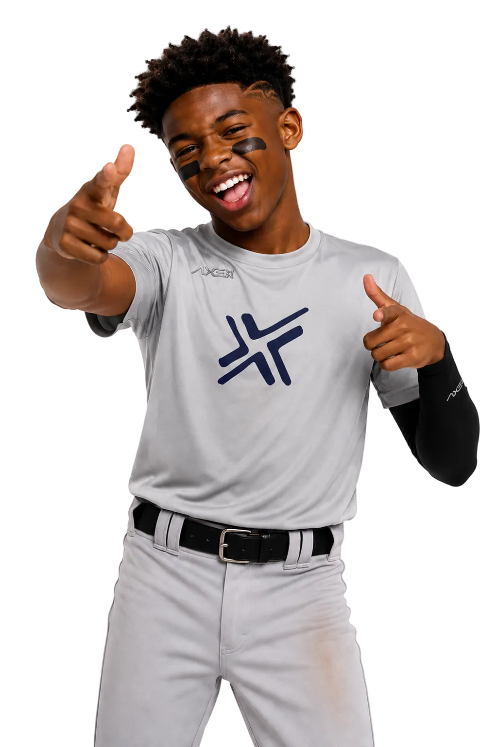 A smiling young man wearing a light gray baseball uniform with a dark blue logo on the chest, posing with both hands pointing forward against a plain white background.