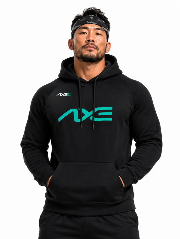 Man wearing the black Axe Scuba Hoodie with the teal AXE logo across the chest, paired with black Axe joggers.