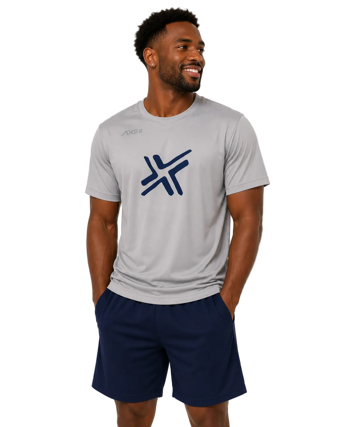 A man wearing a light gray athletic t-shirt with a navy blue logo on the chest and navy blue shorts, standing against a light gray studio background.