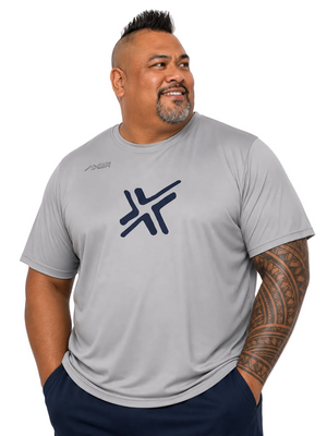 A man wearing a light gray short-sleeve athletic t-shirt with a dark navy blue logo on the chest, photographed against a solid white background.