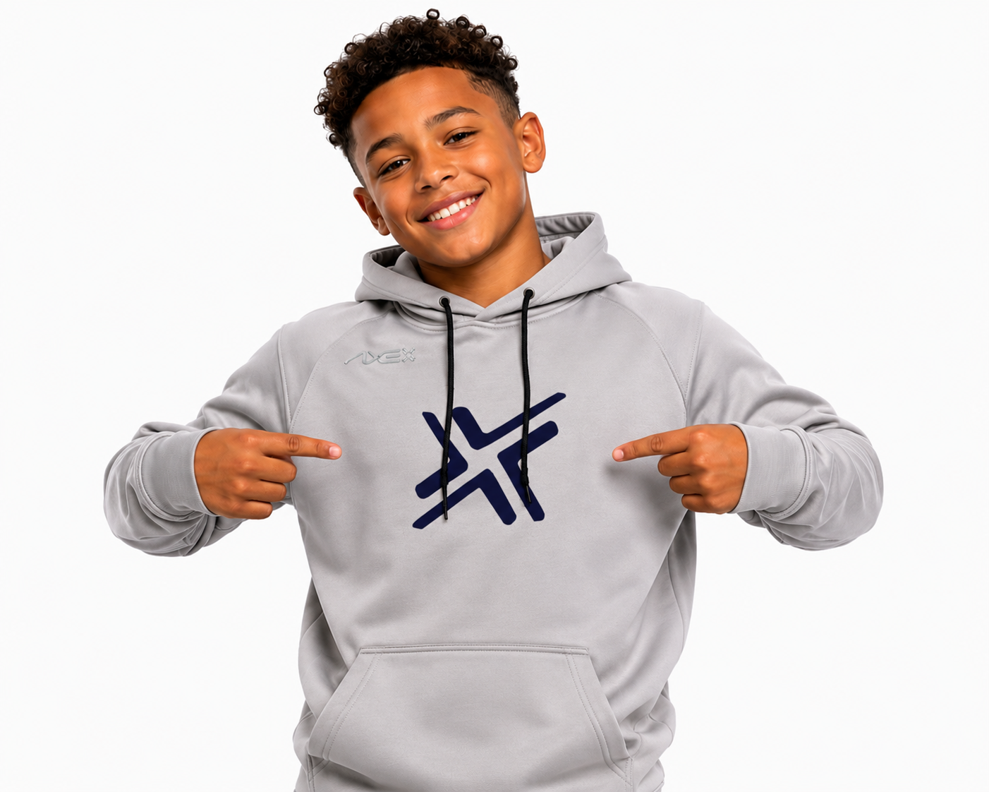 A smiling young man wearing a light gray hoodie with a dark blue stylized logo on the chest, pointing at the logo with both hands against a plain white background.