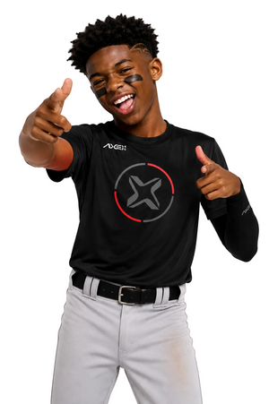A smiling young man wearing a black long-sleeve athletic shirt with a gray star logo and red accent line on the chest, paired with light gray baseball pants, pointing at the camera against a white background.