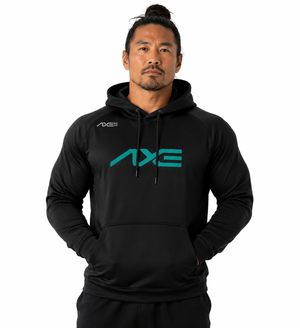 A man wearing a black long-sleeve hoodie with a teal AXE logo on the chest, posed against a solid white background.