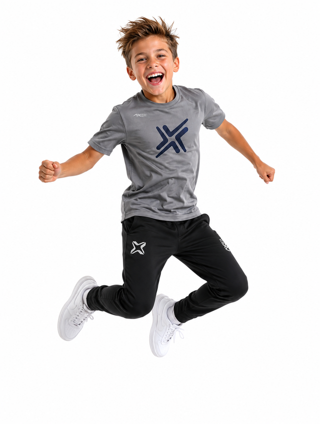 Young ballplayer jumping in black youth Axe Joggers with the white Axe X mark at the left thigh, paired with a gray G1 Axe performance tee.