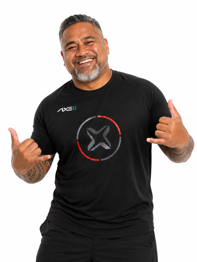 Man wearing the black Fury Bravo Axe Performance Tee with the charcoal Axe X emblem ringed in red and gray on the chest.