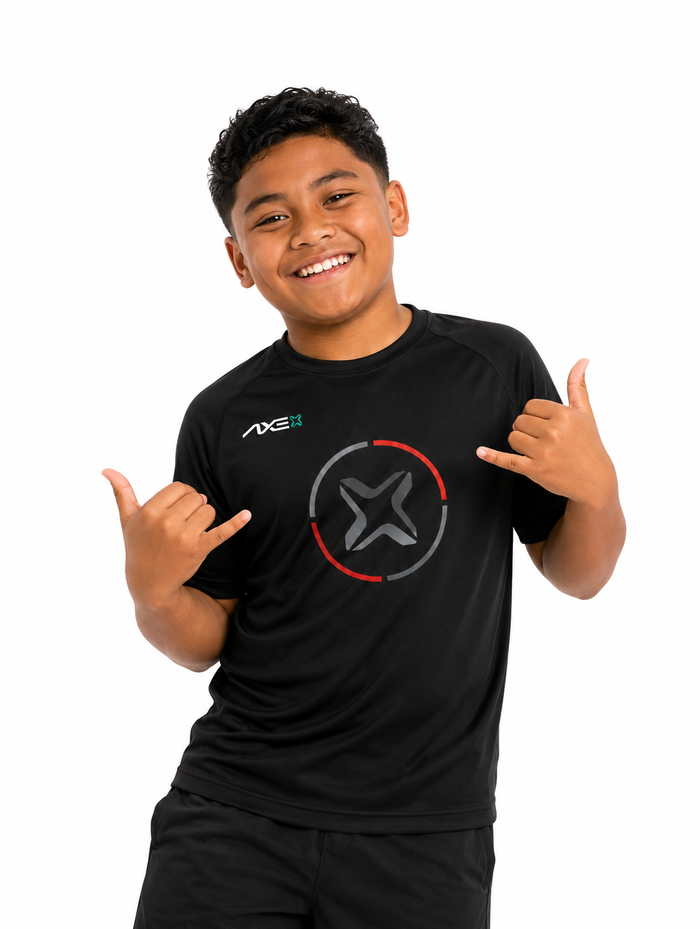 Young ballplayer wearing the black youth Fury Bravo Axe Performance Tee with the charcoal Axe X emblem ringed in red and gray on the chest.
