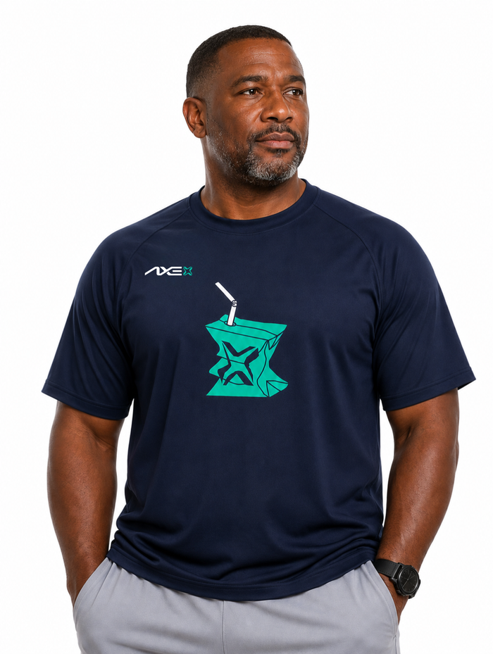 Man wearing the navy Hit Juice Axe Performance Tee with the teal juice box graphic on the chest, paired with gray Axe joggers.