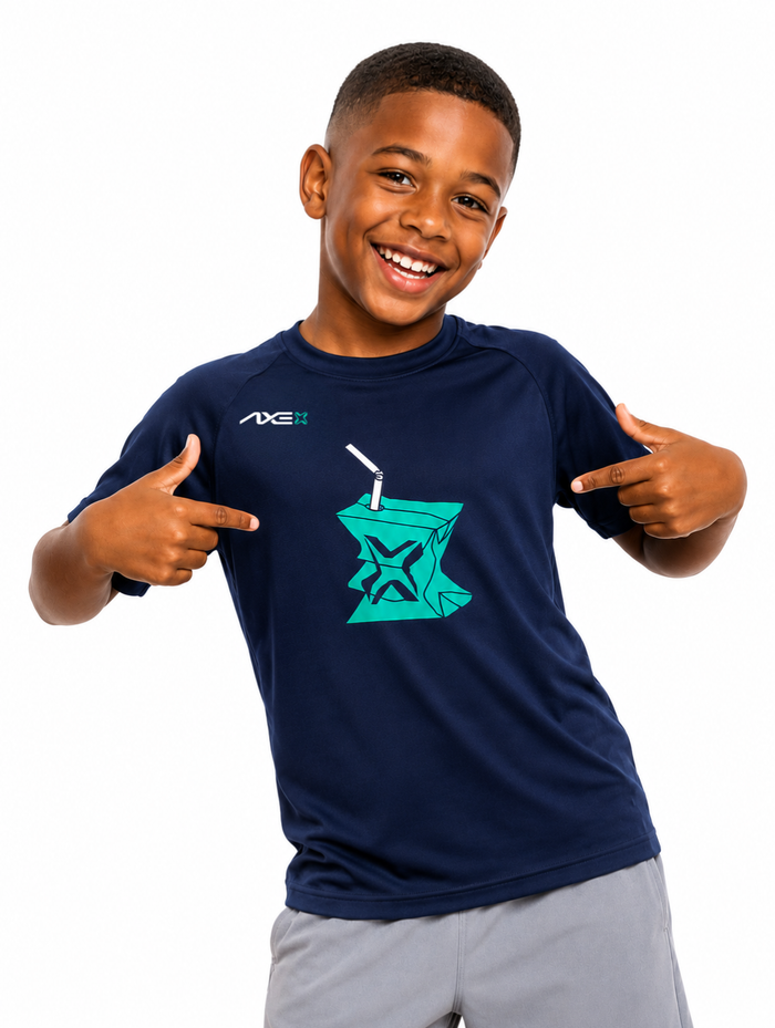 Young ballplayer wearing the navy youth Hit Juice Axe Performance Tee, pointing at the teal juice box graphic on the chest.